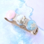 Bracelets and keychains with pendants and cabochons of real flowers and shells