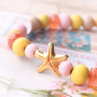 Beach jewellery with wooden beads, shells and DQ European metal