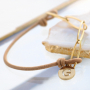 Need some inspiration? It's easy to make trendy bracelets out of elastic cord: