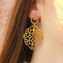 Get creative with stainless steel charms for statement earrings